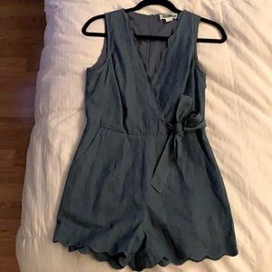 Denim romper with ruffle bottom and top